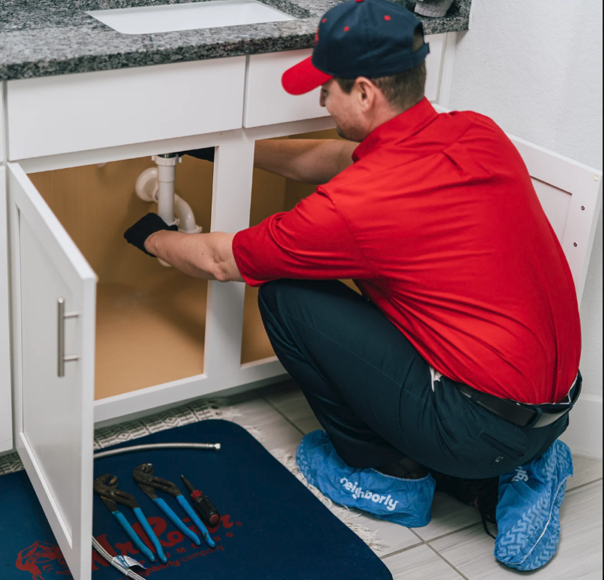 Plumber preparing for an emergency leak repair